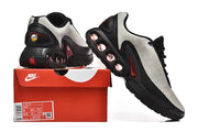 Nike Air Max DN sneakers beside a box; the box label shows size US Men 8 and a product code.