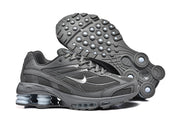 Dark grey Nike Shox Ride 2 sneaker with the textured outsole visible
