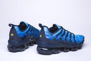 Blue and black Nike Air VaporMax Plus sneakers, side views.
