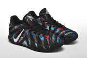 Angled view of both multicolor lace-up basketball shoes