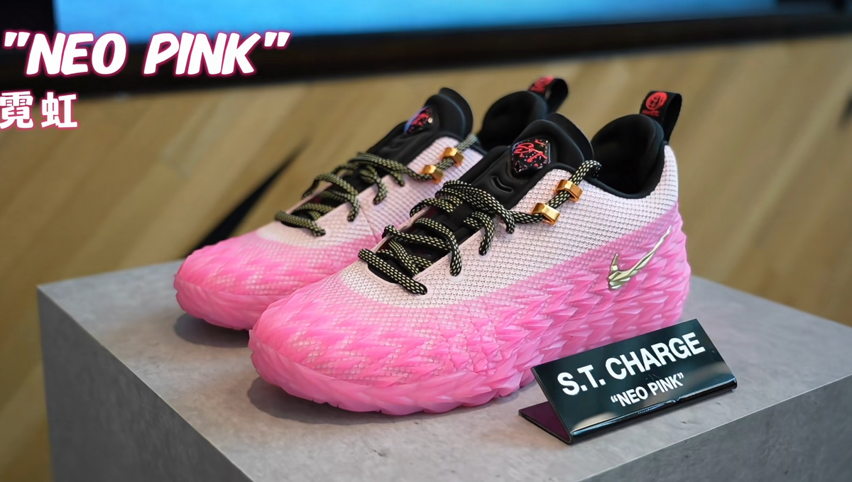 Pair of pink and white ST. CHARGE sneakers with black laces, textured pink soles, and a display card labeled “NEO PINK”.
