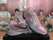 Angled view showing the patterned side panels, dark Swoosh detail, and pink upper.