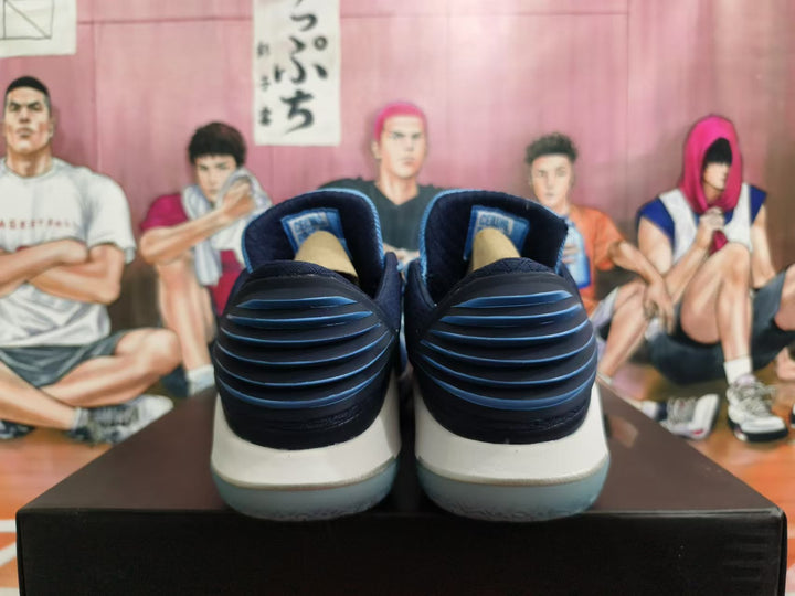 Rear view of blue, navy, and white Jordan basketball shoes