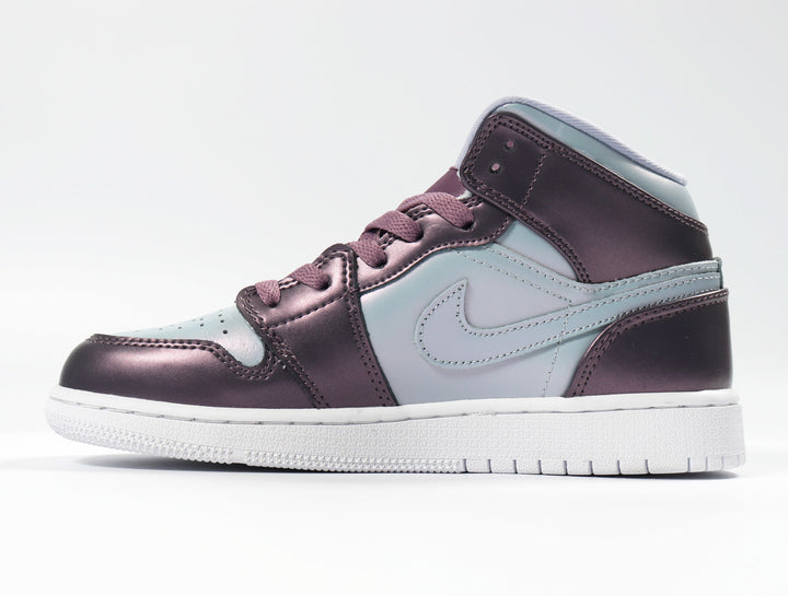 Side view of purple and pale blue Nike high-top sneakers with a white outsole.