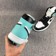 Rear and side view showing the mint green heel panels, black collars, and white midsoles.