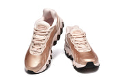 Front view of the Nike Air Max DN 8 pair with pale laces and rose-gold-toned uppers.