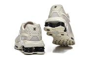 Nike Shox Ride 2 sneakers shown from the heel and outsole.