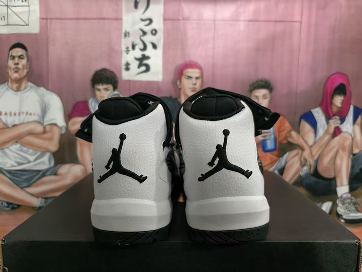 Rear view of white and black high-top sneakers showing the Jumpman logos and black heel panels.