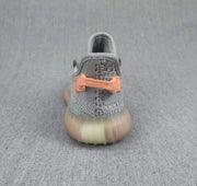 Rear view showing the coral heel pull tab and translucent sole of the gray sneaker.