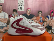 Side profile of a white Nike basketball sneaker with burgundy-red detailing and visible Nike Zoom branding.