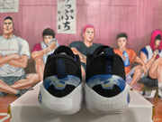 Rear view of black and blue basketball sneakers showing blue heel accents, white midsoles, and FLOW heel markings.
