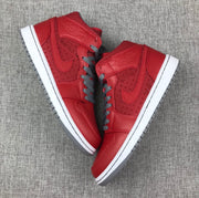 Top-down view of the pair showing the red uppers, gray laces, white midsoles, and gray outsoles.