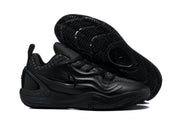 Black sneaker pair showing the wave-pattern outsole tread and side profile.