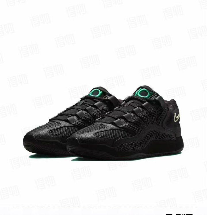 Pair of predominantly black Nike KD 18 basketball sneakers shown at a three-quarter angle, with green tongue branding and light-colored heel Swooshes.