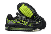 Black Nike Air Max sneakers showing the side profile and bright volt outsole