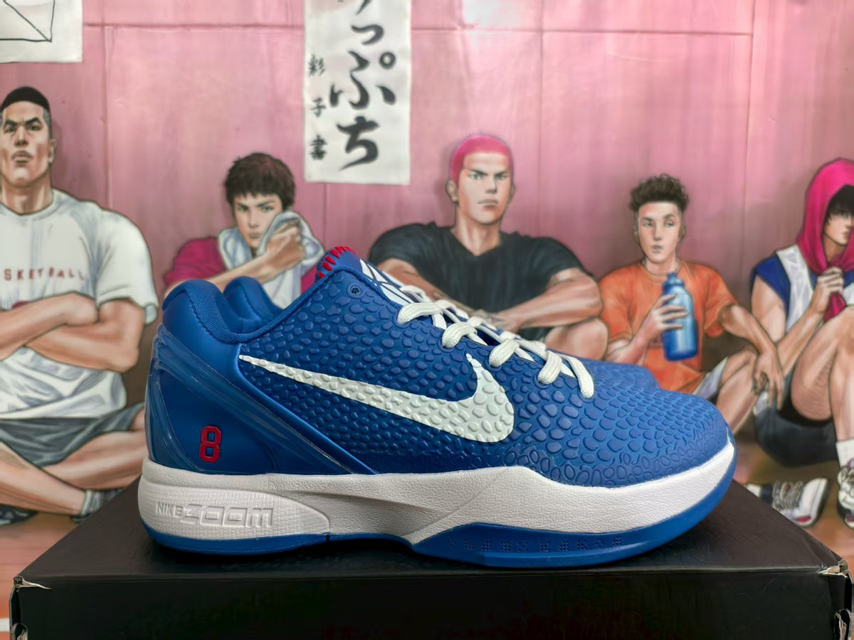 Side view of blue Nike Zoom Kobe basketball sneakers with a white Swoosh, white midsole, and red number 8 detail.