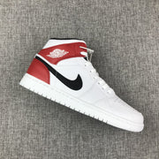 Single Jordan 1 Mid sneaker showing the white side panel, red overlays, and black side logo.