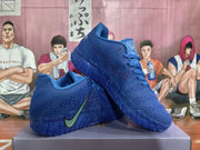 Blue Nike sneakers displayed together, showing the side Swoosh, textured upper, and patterned outsole.