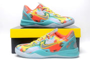 Multicolor basketball sneakers shown on and beside a yellow-and-black shoebox.