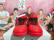 Front view of the red basketball sneakers showing black laces, padded tongues, perforated uppers, and red toe boxes.