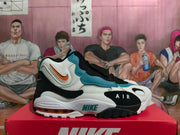 Side view showing the midfoot strap, Air branding, and heel cushioning