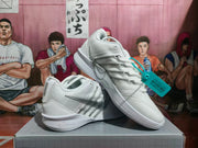 White Nike sneaker shown at an angle, highlighting the silver Swoosh, padded collar, and lace-up construction.