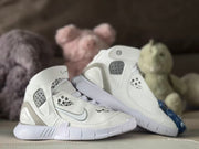 Angled product view showing the white upper, gray side details, ankle panels, and outsole.