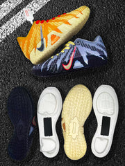 Yellow and blue Nike basketball sneakers shown from the side with separated outsole components.