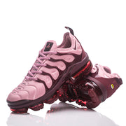 Nike TN-18 sneakers displayed at an angle, showing the sculpted upper and sole.