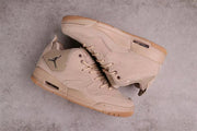 Pair of brown sneakers arranged to show the side profile, outsole edges, and sole windows.
