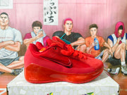 Side view of a red Nike basketball sneaker with a visible Swoosh and glossy heel section.