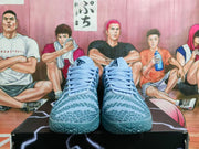 Front view of the pair of light blue Nike basketball sneakers with matching laces and textured toe areas.