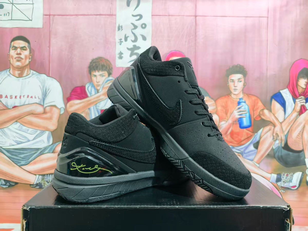 Pair of black Nike basketball sneakers displayed on a box, showing the side Swoosh, layered upper, heel detail, and textured outsole.