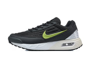 Side view of black Nike Air Max Verse sneakers with a volt-green Swoosh, white midsole, and visible heel air unit.