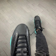 Close-up top view of the black toe box, laces, and tongue