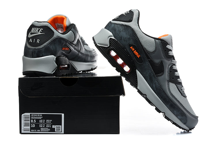 Grey and black Nike Air Max 90 sneakers shown from the rear and side, with a box label visible.