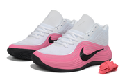 Pair of white and pink Nike basketball sneakers with black swoosh detailing and spare pink laces.