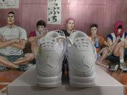 Rear view of the white sneakers showing the padded collars and visible Jumpman logos on the heels.