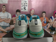 Rear view of white Nike basketball sneakers showing ribbed heel panels, turquoise-green accents, and Nike branding.