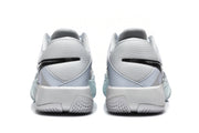 Rear view of the Nike GT Cut sneakers showing the mesh heel panels, black Swoosh detailing, and textured outsoles.