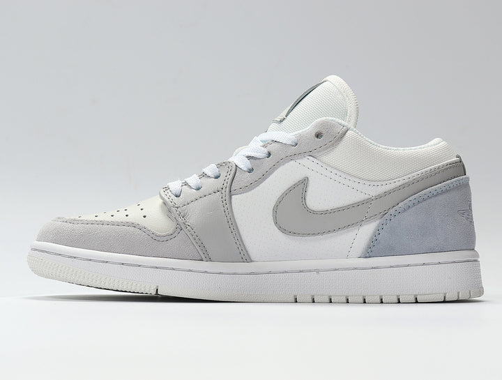 Side profile of a white and light grey low-top sneaker with a Swoosh, layered panels, perforated toe and textured outsole.