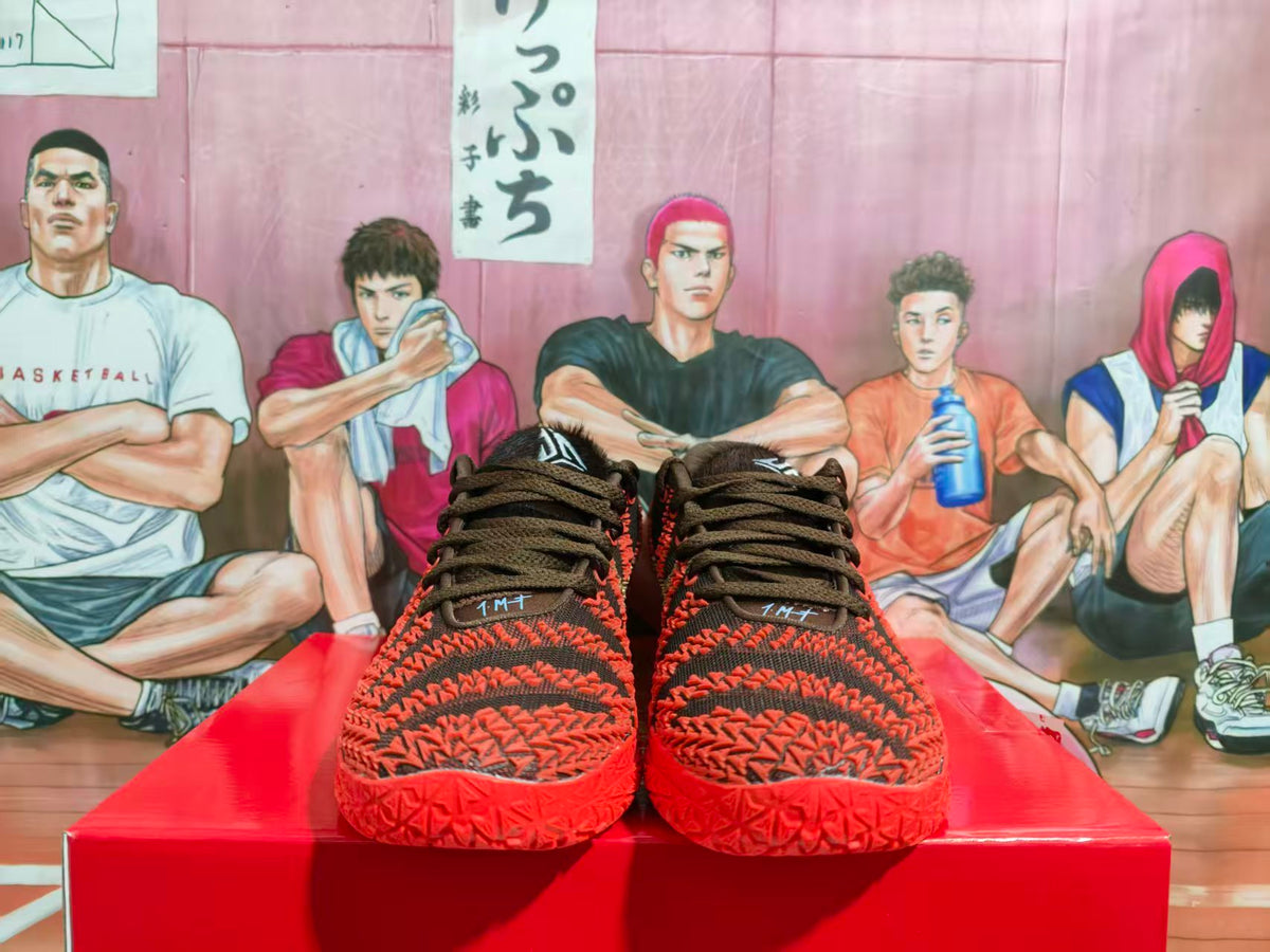 Front view of black and red Nike basketball sneakers displayed on a red box.
