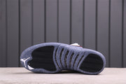 Underside view showing the blue-gray speckled outsole and black traction sections.