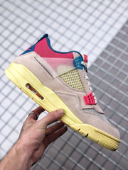 Side profile highlighting the cream upper, pink and blue lace hardware, yellow midsole, and visible Air window.