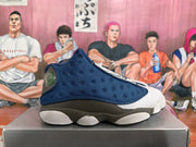 Side profile of a navy, charcoal, and white Jordan basketball sneaker