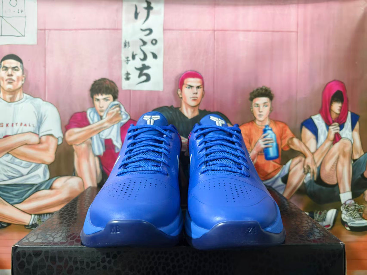 Front view of blue Nike Kobe basketball shoes with perforated toe panels and blue laces