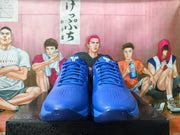 Front view of blue Nike Kobe basketball shoes with perforated toe panels and blue laces