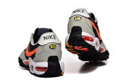 Rear views of Nike Air Max Waffle SP sneakers showing gray heel panels and black-and-orange outsoles.