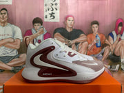 Side profile of a white and burgundy Nike Zoom sneaker with visible lateral branding and layered panel details.