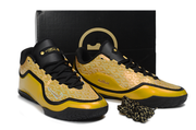 Yellow and black Nike LeBron 23 basketball shoes displayed with a black shoebox.